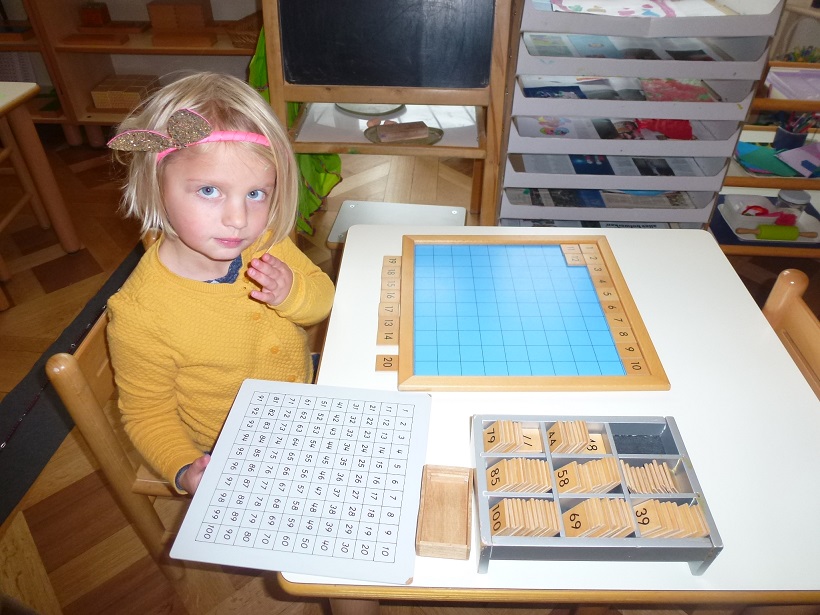 A girl learning to order numbers.