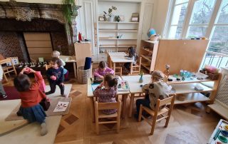 Children in a classroom working independently.