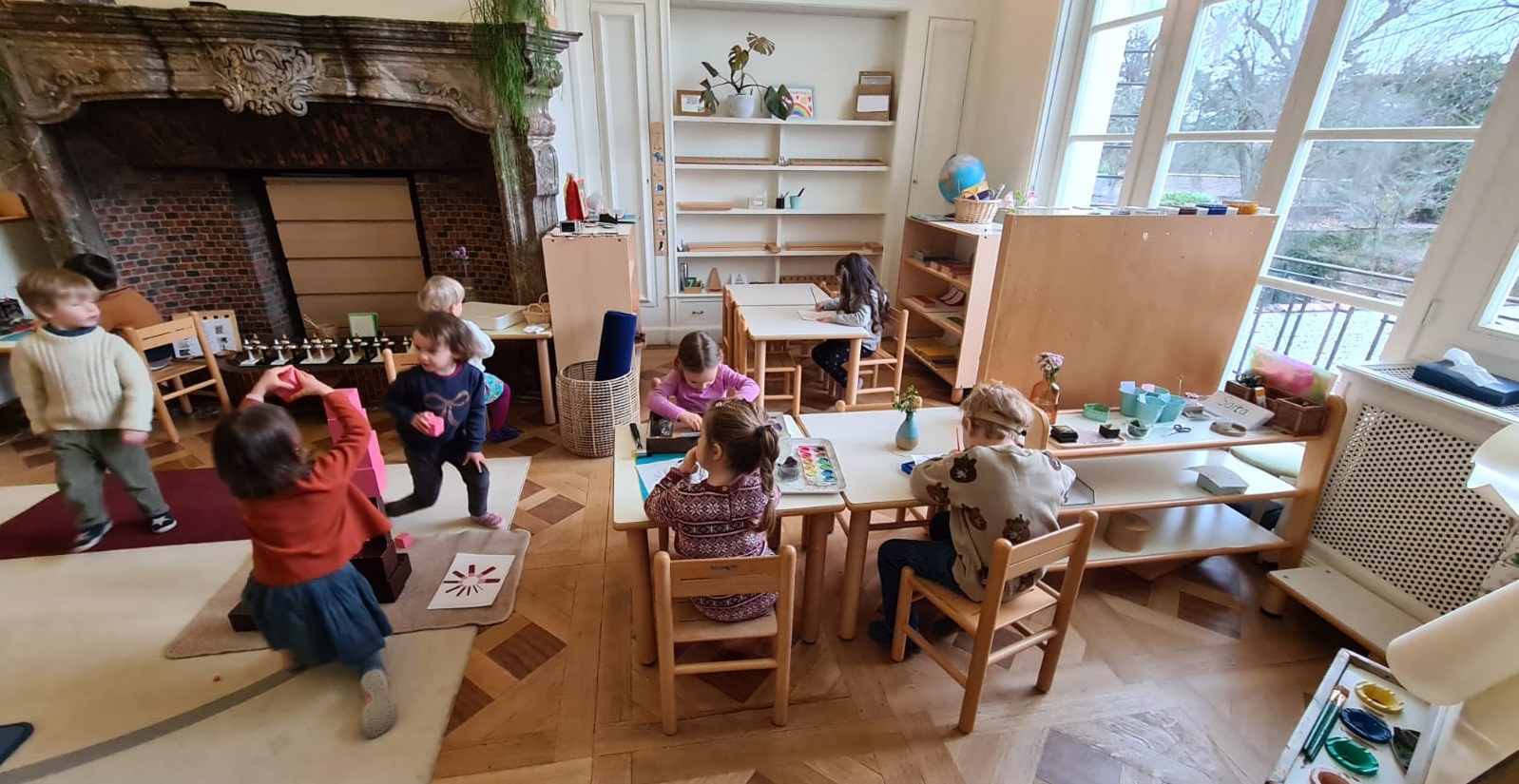 Children in a classroom working independently.